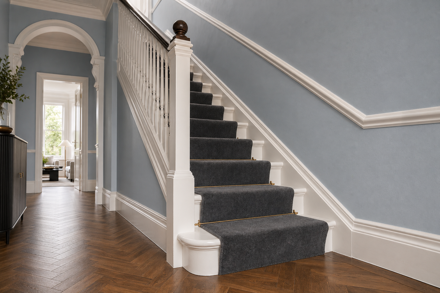 Decorated hallway and staircase with crisp trim
